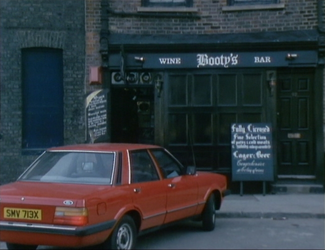 The Watermans Arms when it was Bootys Wine Bar, from the the 1980 BBC TV series, The Chinese Detective. Episode, Wheels Within Wheels.